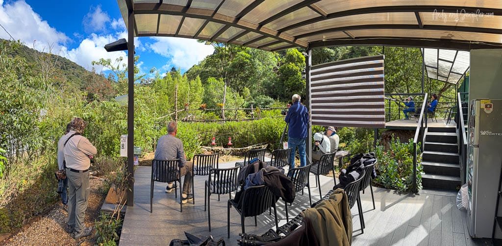 Bird photographers photographing hummingbirds from the covered viewing area at Savegre Lodge Gardens in the Savegre Valley, Costa Rica.