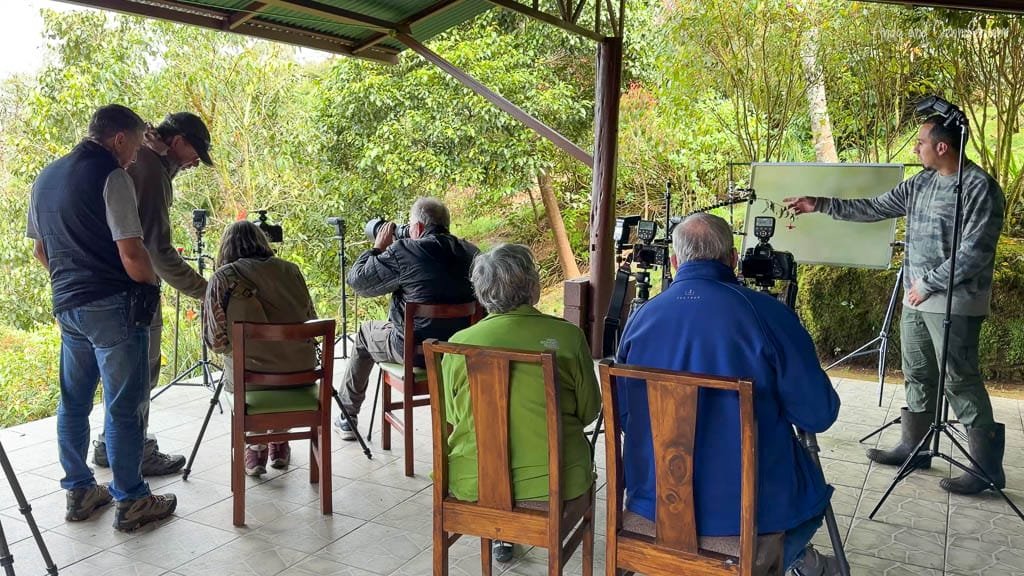 Photographers using a professional hummingbird flash photography setup at Paraíso Quetzales in the Savegre Valley, Costa Rica.