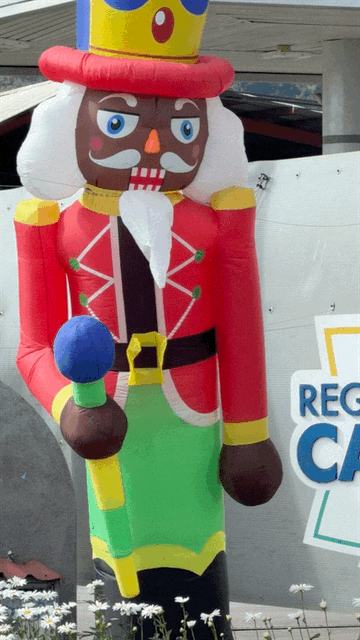Large inflatable nutcracker decoration at a roadside rest stop during our drive through Costa Rica.