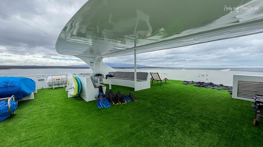 Outdoor deck aboard the Ecogalaxy catamaran with snorkelling gear ready for Galápagos excursions.