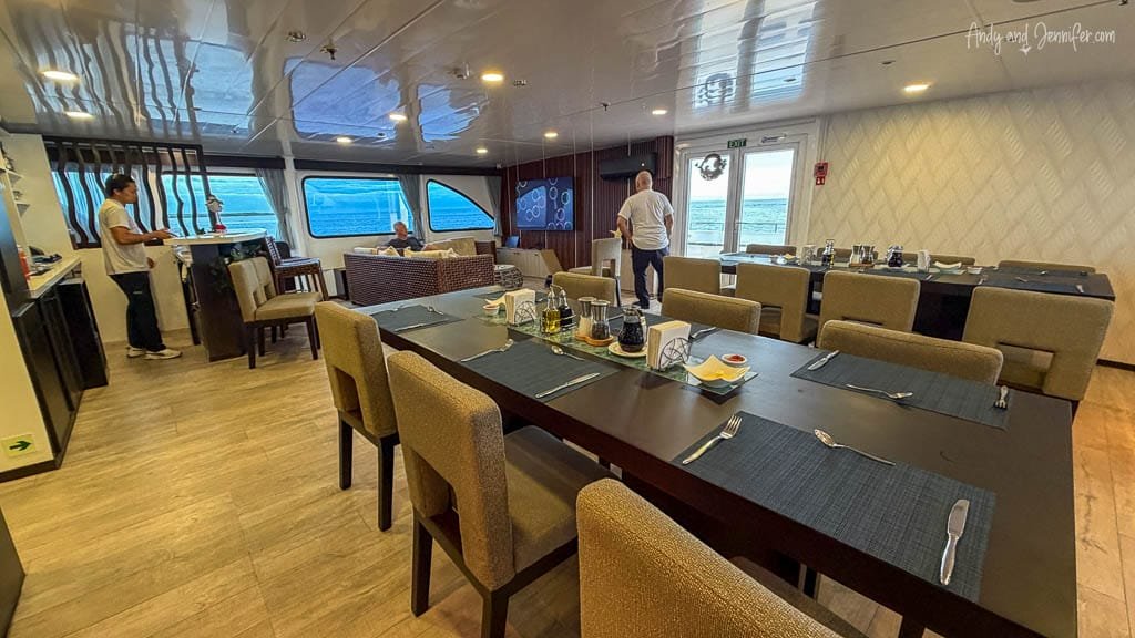 Dining and lounge area aboard the Ecogalaxy catamaran in the Galápagos.