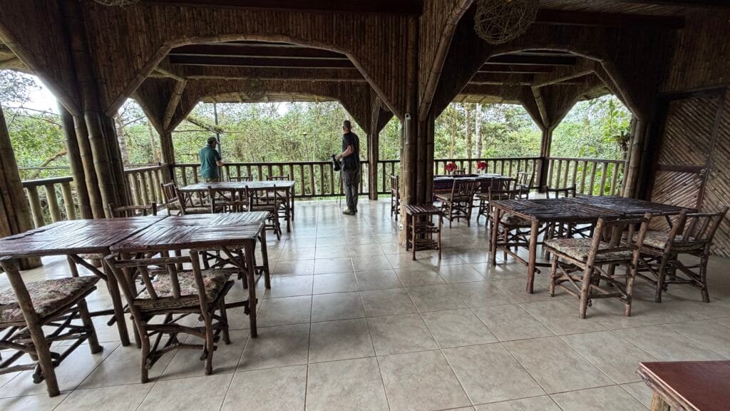Open-air dining area overlooking the surrounding forest at San Jorge Milpe, Pichincha, Ecuador.