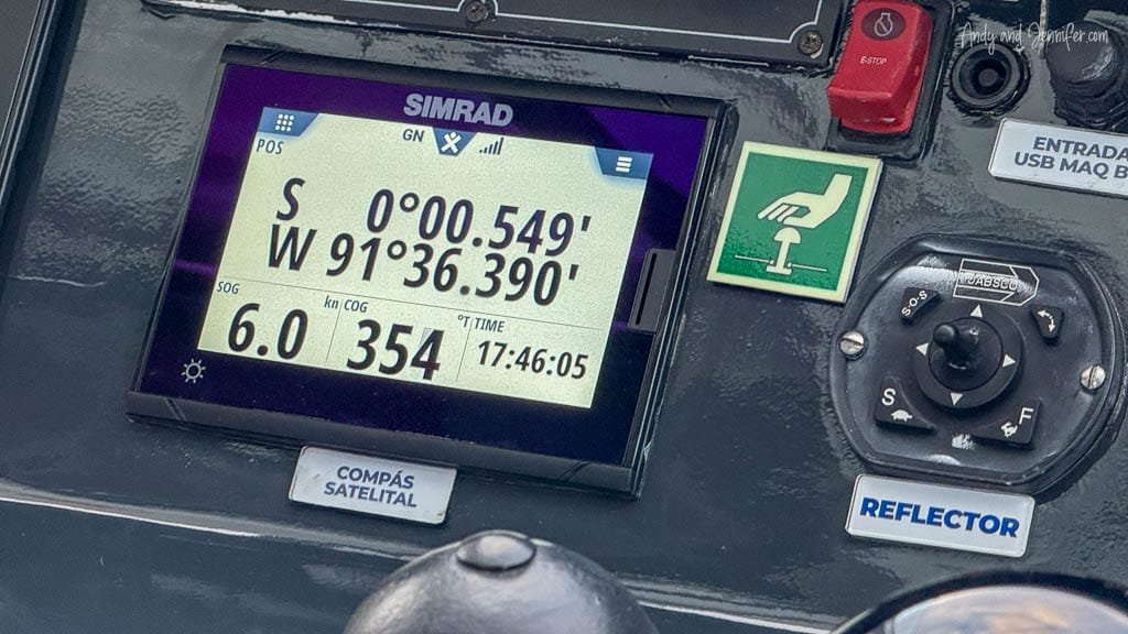 GPS display showing the Ecogalaxy crossing the equator at 0° latitude near Fernandina Island in the Galápagos.