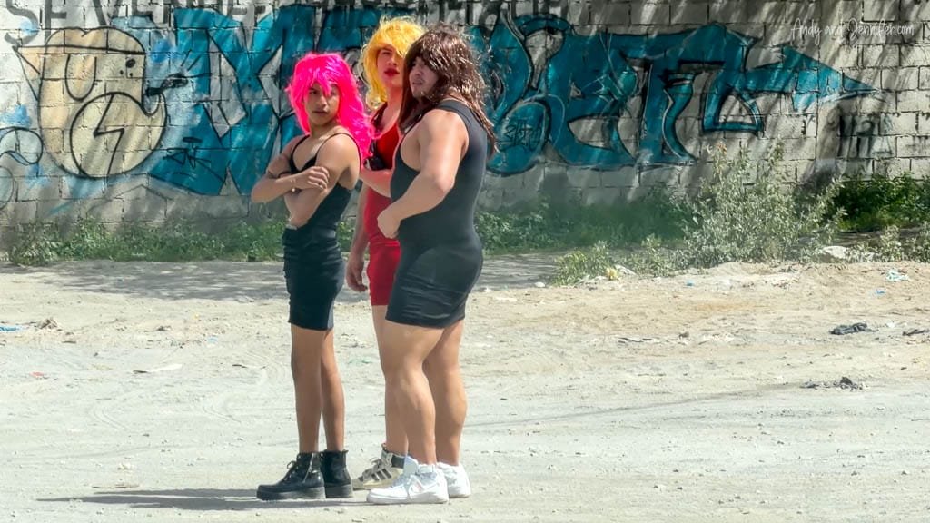 Men dressed as New Year’s widows in wigs and dresses stopping traffic on New Year’s Eve in Quito, Ecuador.