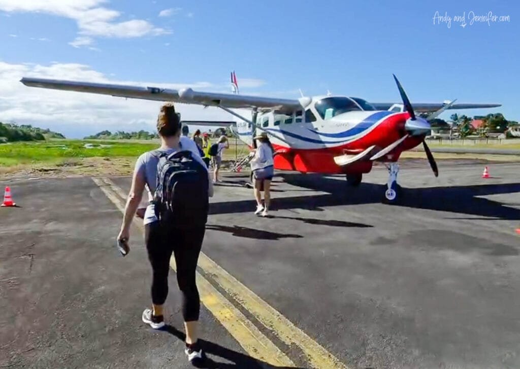 Passengers walk across the tarmac to board a small Cessna Caravan at Changuinola Airport in Panama for a regional flight to Bocas del Toro.