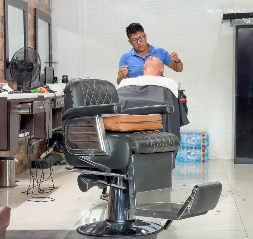 Andy getting a haircut and shave during our final morning in San José, Costa Rica.