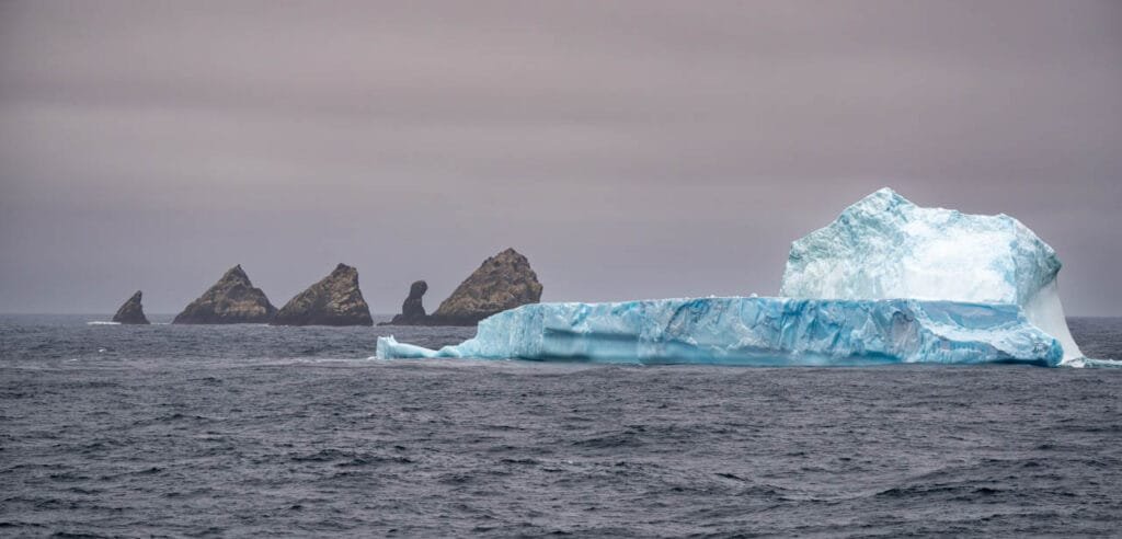 Large blue iceberg drifting in the Southern Ocean beside Shag Rocks, South Georgia.