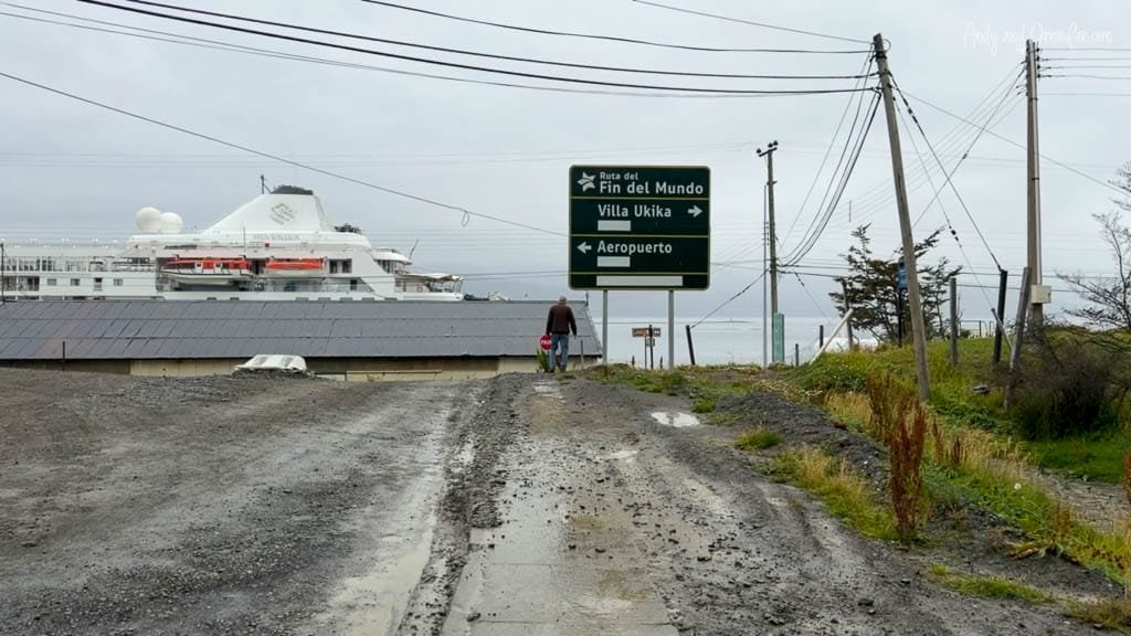 Road sign for the Ruta del Fin del Mundo near the waterfront in Puerto Williams, Chile, with Silver Wind docked in the background.