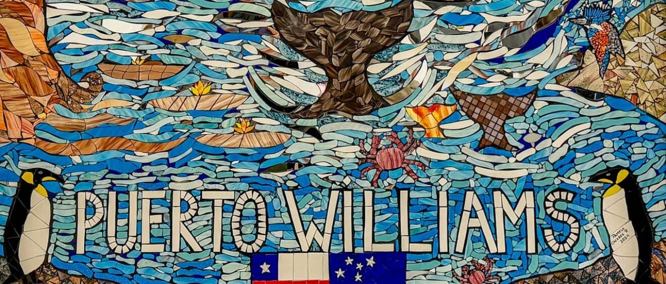 Mosaic artwork featuring penguins, marine wildlife and the words “Puerto Williams” in Puerto Williams, Chile.