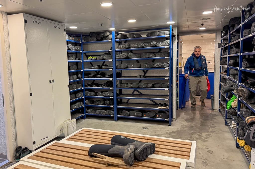 Expedition boot room aboard Silver Wind, with rows of rubber boots stored on racks for shore landings.
