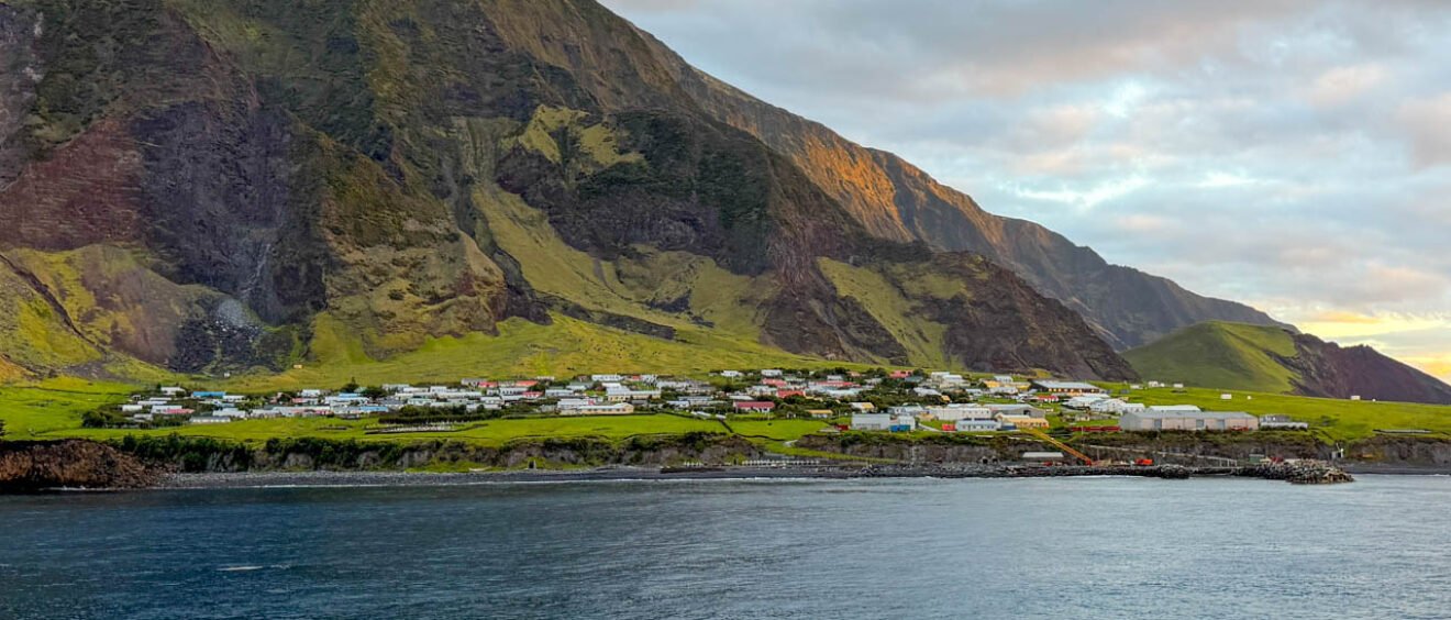 Edinburgh of the Seven Seas settlement beneath the steep volcanic slopes of Tristan da Cunha, viewed from the sea.