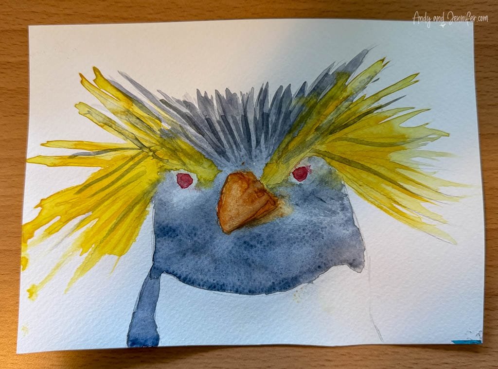 Watercolour painting of a northern rockhopper penguin with bright yellow crest feathers, created during an art workshop aboard Silver Wind.