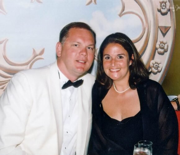 Andy and Jennifer posing for a photo at dinner on a cruise in 2003